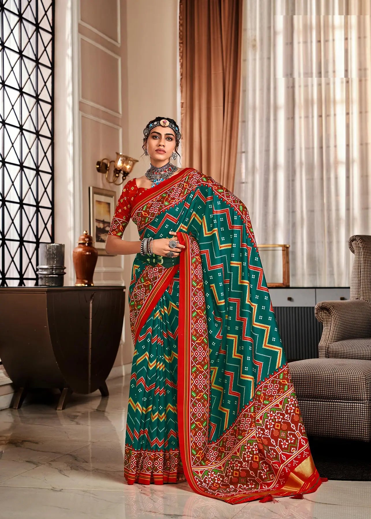 Dark Green Handloom Silk Saree with Patola Print & Tassel Pallu