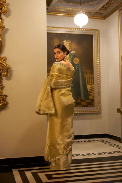Golden Shimmer Tissue Saree With Zari Weaving Work & Sequins Lace Border