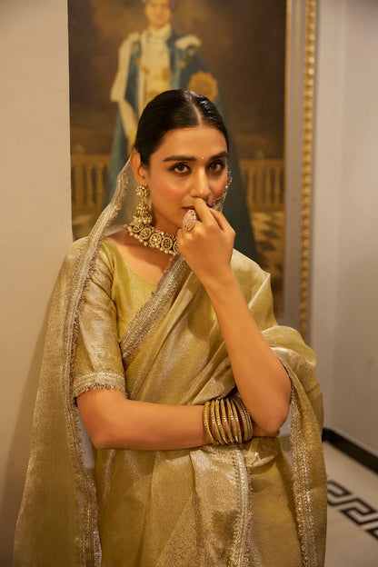 Golden Shimmer Tissue Saree With Zari Weaving Work & Sequins Lace Border